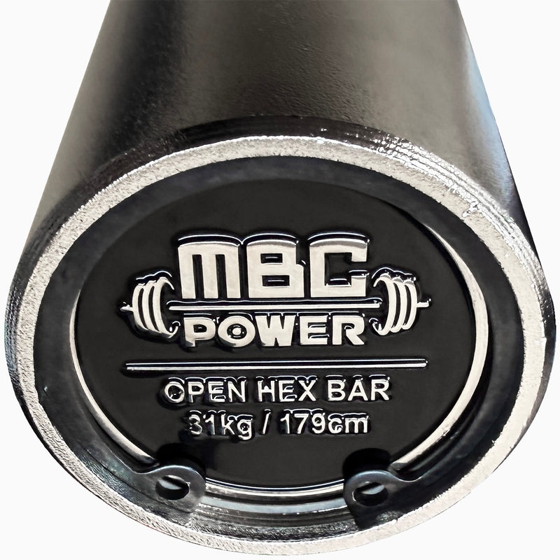 MBC オープンヘックスバー ブラックのスリーブエンドキャップを正面接写で撮影、ロゴ刻印と31kg・179cm表記、金属縁の仕上げが確認できる構図